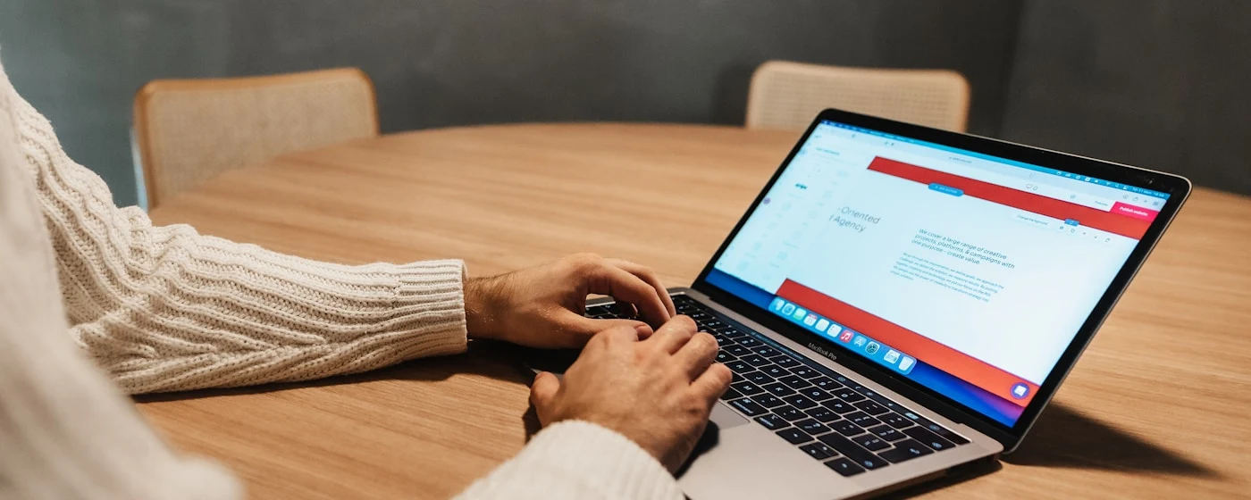 Marketing manager reviewing SEO deliverables and website work on a laptop after onboarding